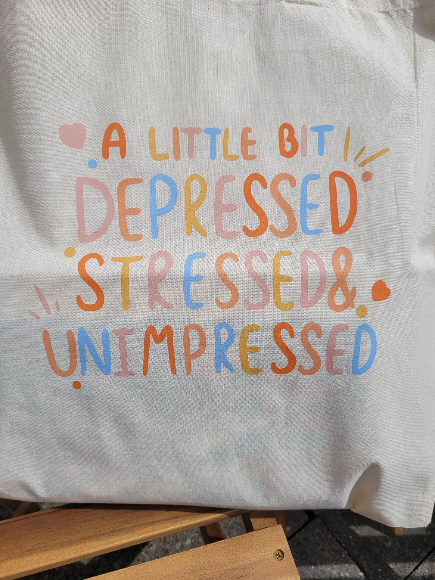 Depressed, stressed and unimpressed tote bag