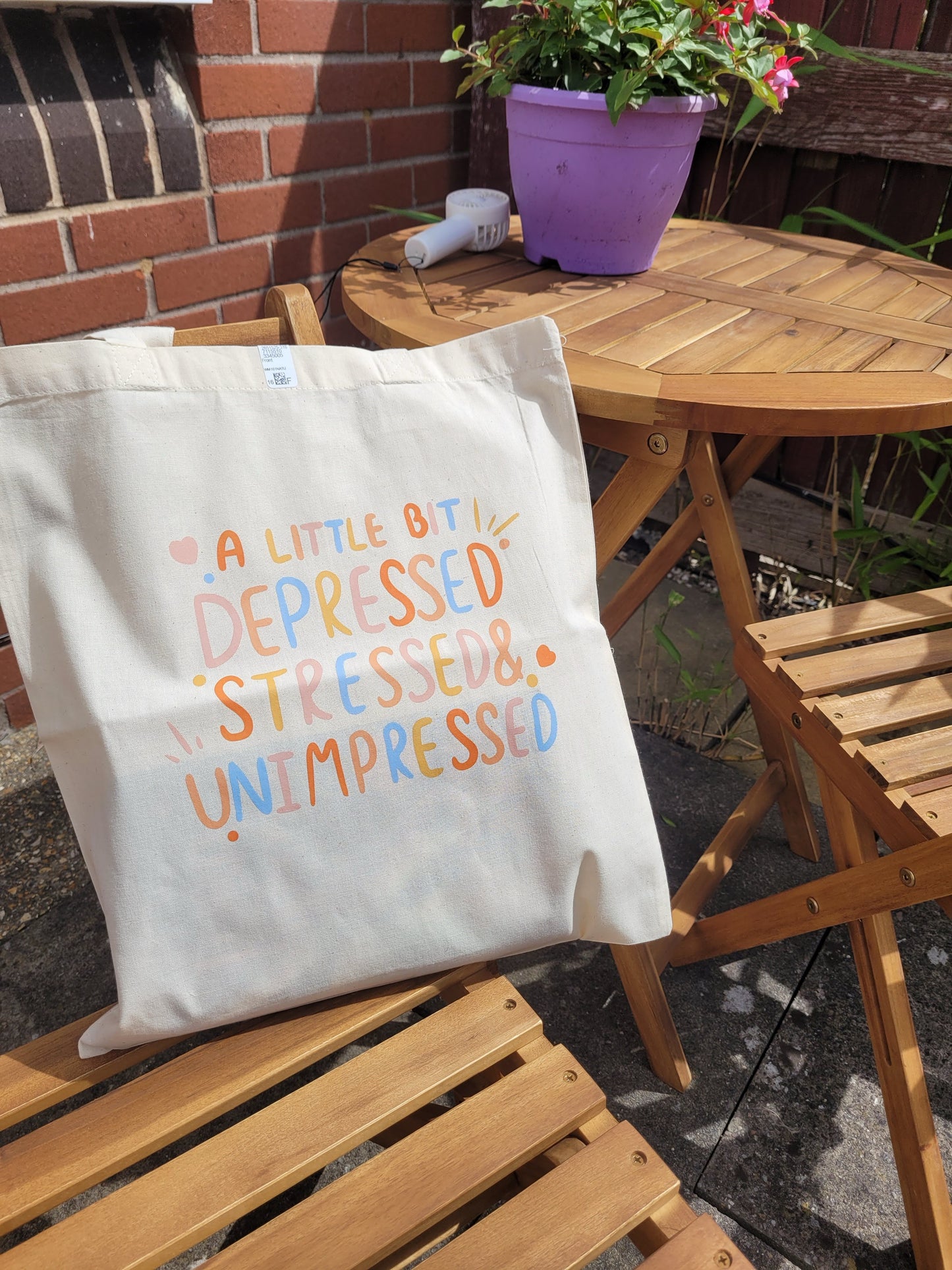 Depressed, stressed and unimpressed tote bag